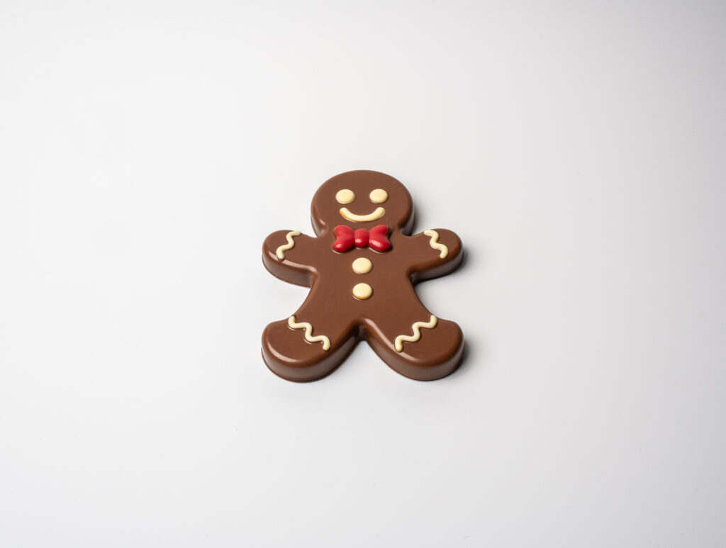 Zenzì , barretta di cioccolato al latte ripiena di pan di zenzero, cremino al caramello e biscotti